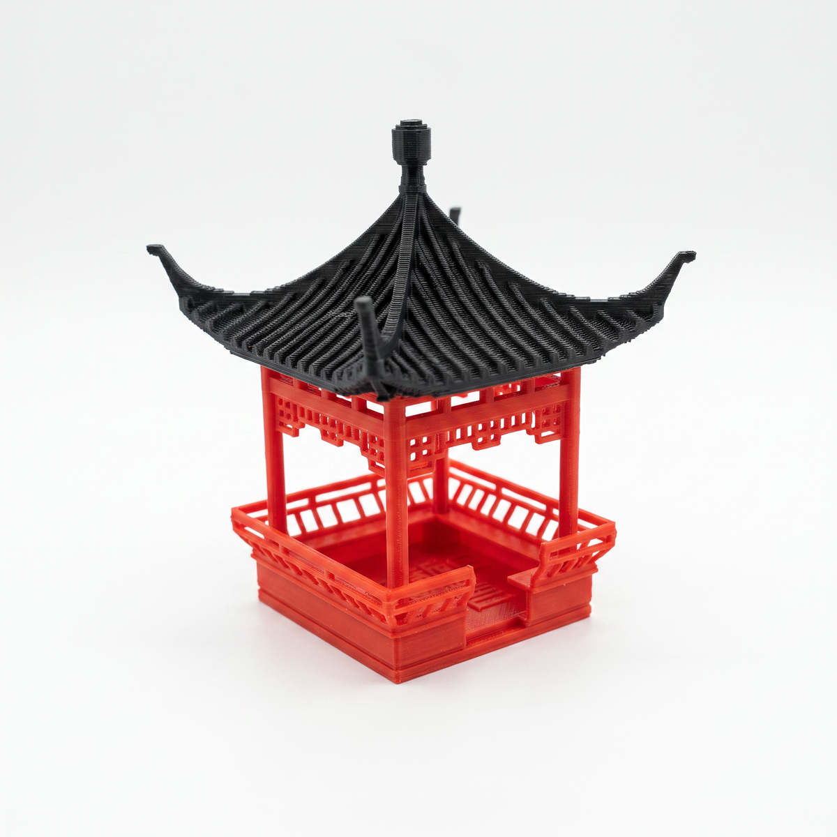 A miniature red and black Chinese pagoda model, likely a 3D-printed miniature or toy structure, shown on a clean white background.