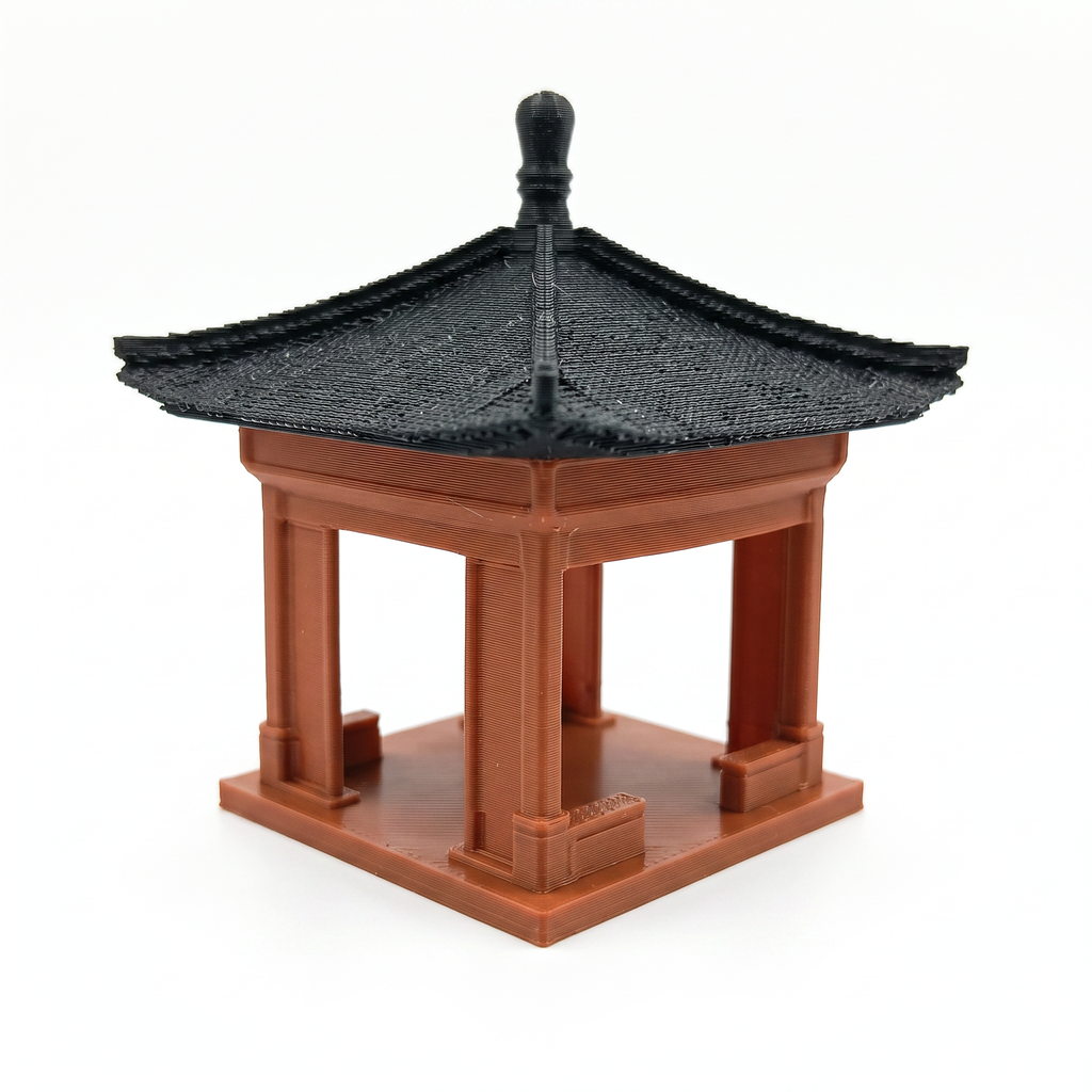 A miniature traditional-style pagoda or pavilion model with a black tiled roof and reddish-brown wooden structure, shown on a plain white background. Aquarium decoration and terrarium decoration.